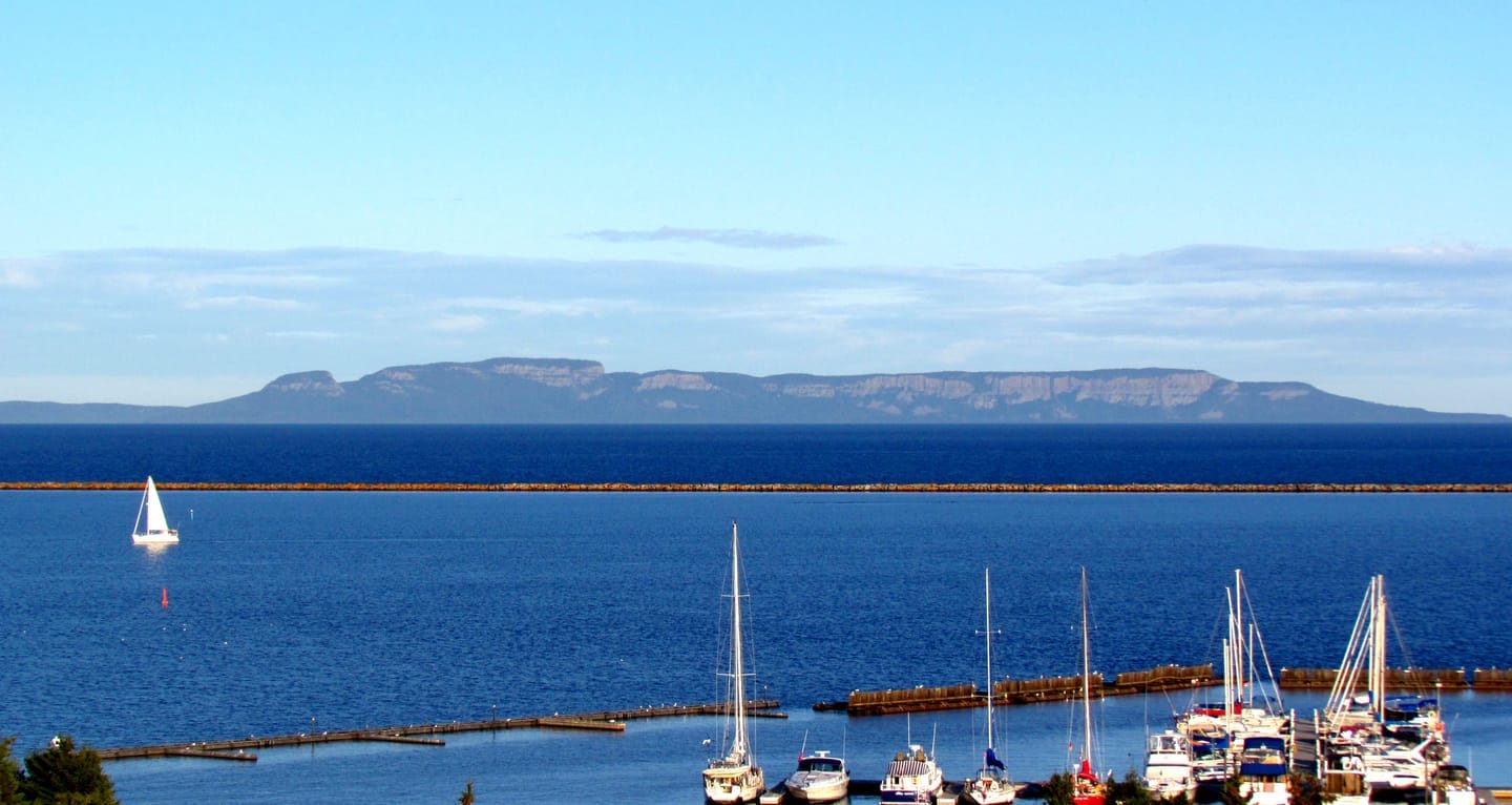 The Sleeping Giant landform on the Sibley Peninsula in Lake Superior. Three flat-topped diabase mesas separated by erosion notches; the silhouette reads as a reclining figure.